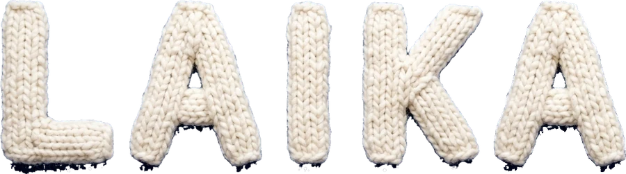 LAIKA spelled out in knitted white yarn letters